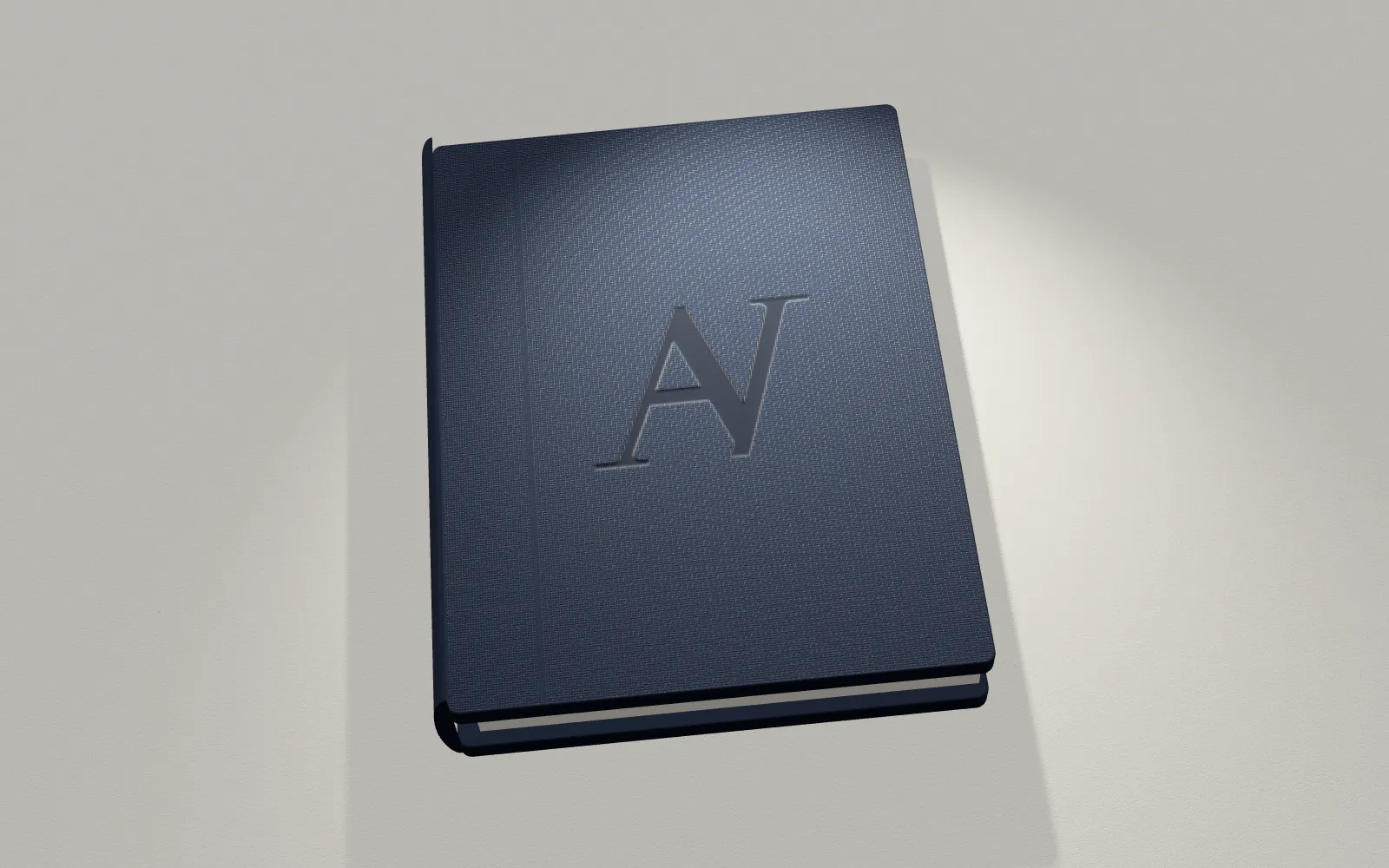 A navy cloth-bound book with the Aureum Vita monogram pressed into the cover.